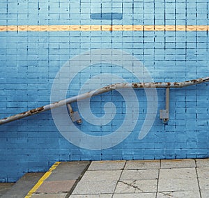 Green stucco wall texture with metal railing for background or copy space.