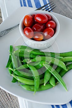 Green sugar beans and Cherry tomatoes photo