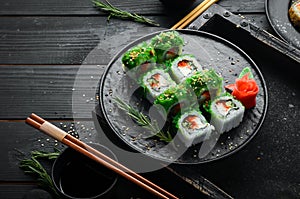 Green sushi. Japanese sushi with Chuka salad. Asian Diet Food.