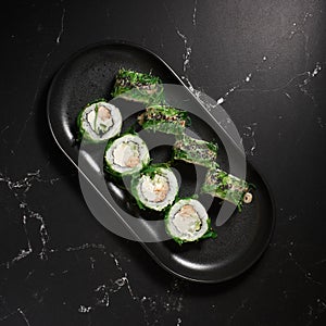 Green sushi. Japanese sushi with Chuka salad. Asian Diet Food. Top view.