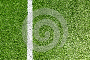 Green synthetic artificial grass soccer sports field with white corner stripe line