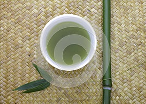 Green tea bowl with bamboo