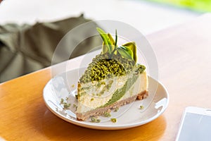 Green tea cheese cake on white dish