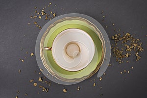 Green tea cup on a gray background