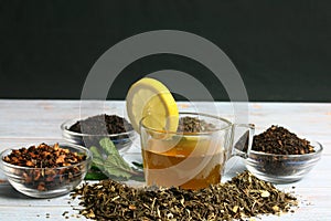 Green tea cup with a lemon wedge and mint leaves