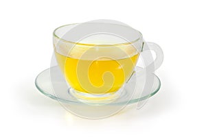 Green tea in glass cup on glass saucer