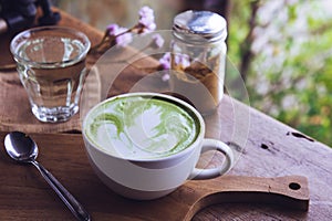 Green tea hot drink latte white cup on wood table aroma relax ti