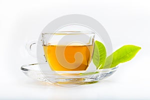 Green tea leaf and glass cup of black tea