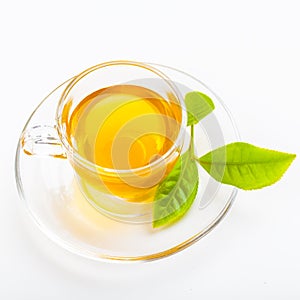 Green tea leaf and glass cup of black tea