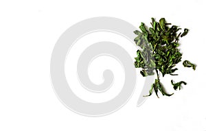 Green tea leaves in tree shape on white isolated background.Green dry tea leaves