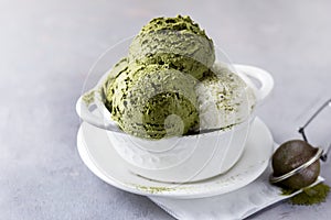 Green Tea Matcha and Coconut Ice Cream in White Bowl on a Grey Background Tasty Healthy Vegan Ice Cream Horizontal