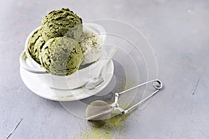 Green Tea Matcha and Coconut Ice Cream in White Bowl on a Grey Background Tasty Healthy Vegan Ice Cream Horizontal