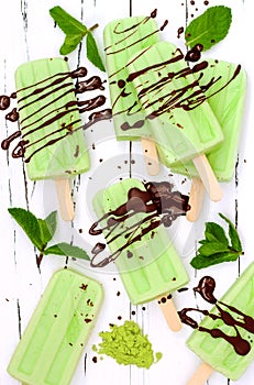 Green tea matcha mint popsicles with chocolate and coconut milk.