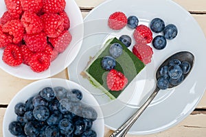 Green tea matcha mousse cake with berries