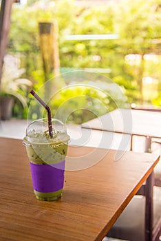 Green tea milk on the wood table