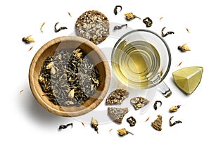 Green tea with natural flavors and a cup. Top view on white background