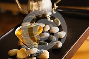 Green tea and pebble stones