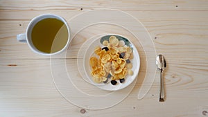 Green Tea and snack on wooden table