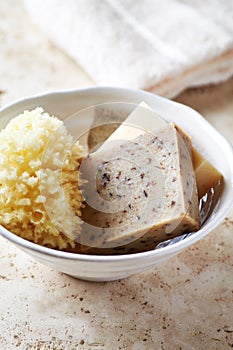 Green Tea Soap and Natural Bath Sponge in a Ceramic Dish