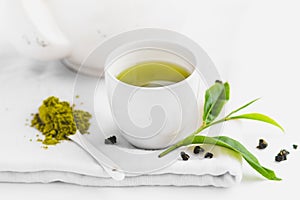 Green tea In white cup White background aroma