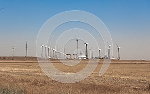 Onshore wind farm, using several horizontal axis turbines, summer day