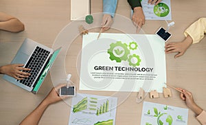 Green technology illustration placed at meeting table. Top view. Delineation.