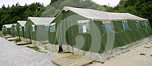 Green tent camp in Pyrenees for Santiago pilgrims photo