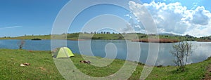 Green tent by the Biviere Lake in Nebrodi Park, Sicily