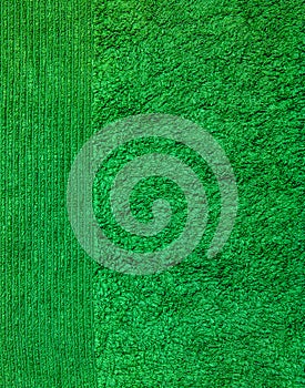 Green terry towel background. Texture of terry cloth