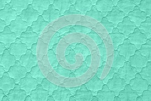 green textures background, close-up of sea green quilt, aquamarine counterpane bedspread