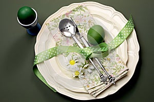 Green theme Happy Easter dinner or breakfast table setting