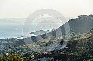 Green Thracian cliffs near blue clear water of Black Sea, bulgar