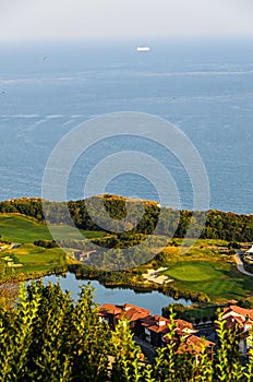 Green Thracian cliffs near blue clear water of Black Sea, lake g