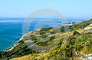 Green Thracian cliffs near blue clear water of Black Sea, rocky