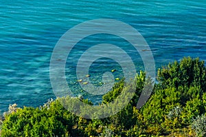 Green Thracian cliffs near blue clear water of Black Sea, rocky