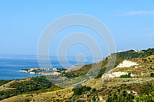 Green Thracian cliffs near blue clear water of Black Sea, rocky