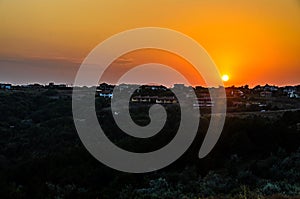 Green Thracian cliffs near blue clear water of Black Sea, sunset