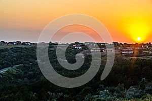 Green Thracian cliffs near blue clear water of Black Sea, sunset