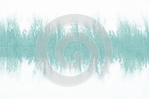 Green tie dyed pattern on cotton fabric dip dyed technique abstract background.