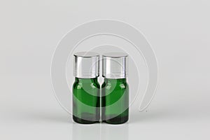 Green tinted Essential Health Oil bottles