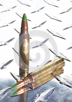 Green tipped ammunition on metal