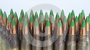 Green tipped bullets on white