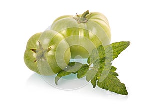 Green tomatoes vegetables with leaves isolated