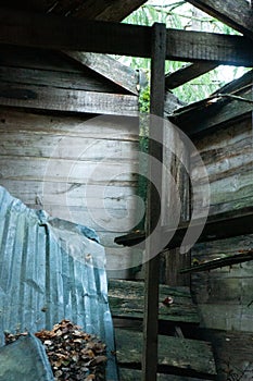 Rustic abandoned shed interior with light streaming in from above