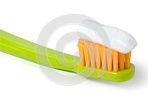 Green toothbrush on a white background. Full depth of field