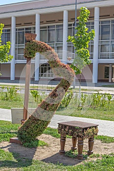 Green topiary statue of a harp