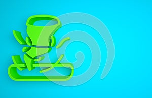 Green Tornado icon isolated on blue background. Cyclone, whirlwind, storm funnel, hurricane wind or twister weather icon