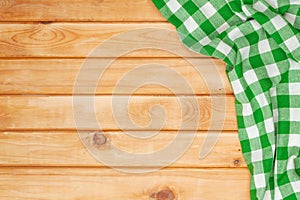 Green towel over wooden kitchen table