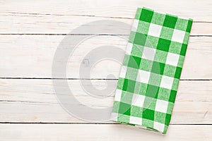 Green towel over wooden kitchen table