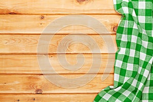 Green towel over wooden kitchen table